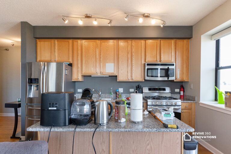 messy kitchen with old cabinets