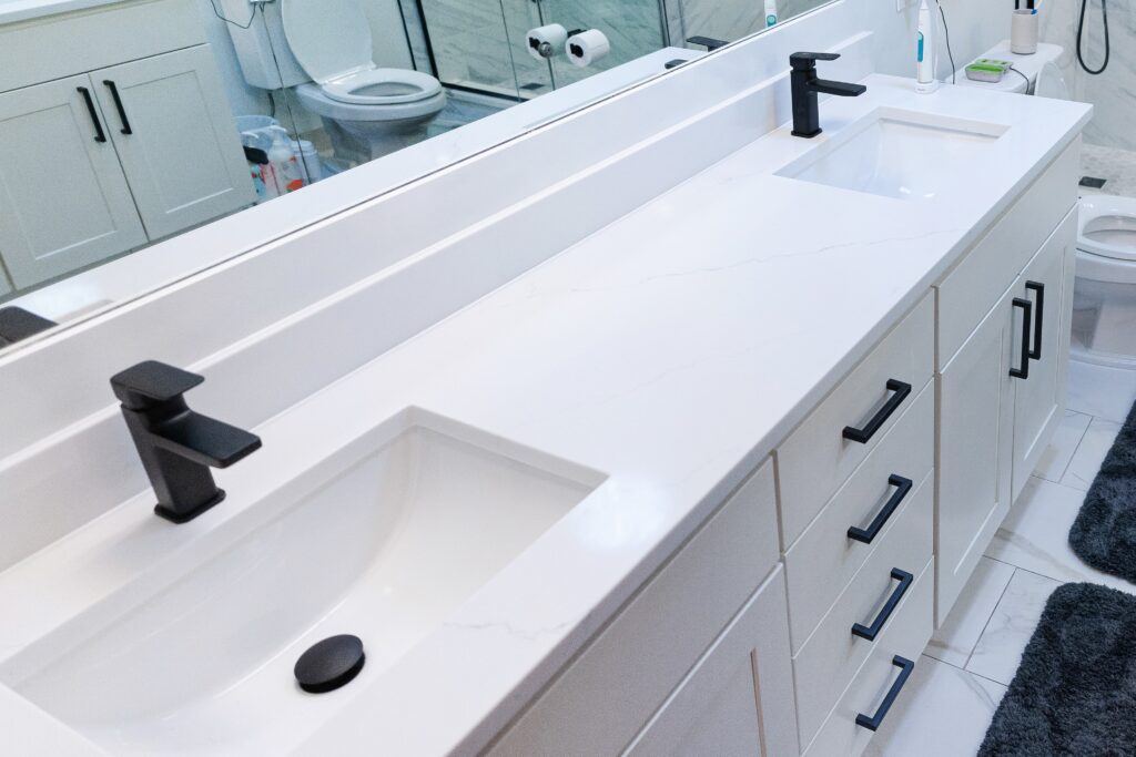 bathroom white marble countertop with two sinks