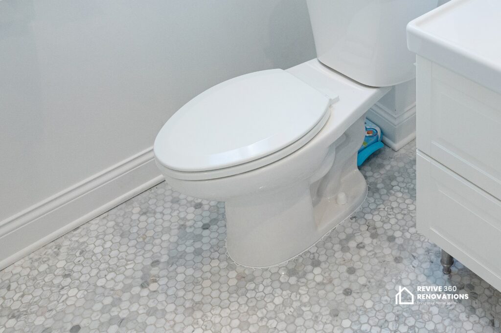 toilet in a bathroom with new tile floor