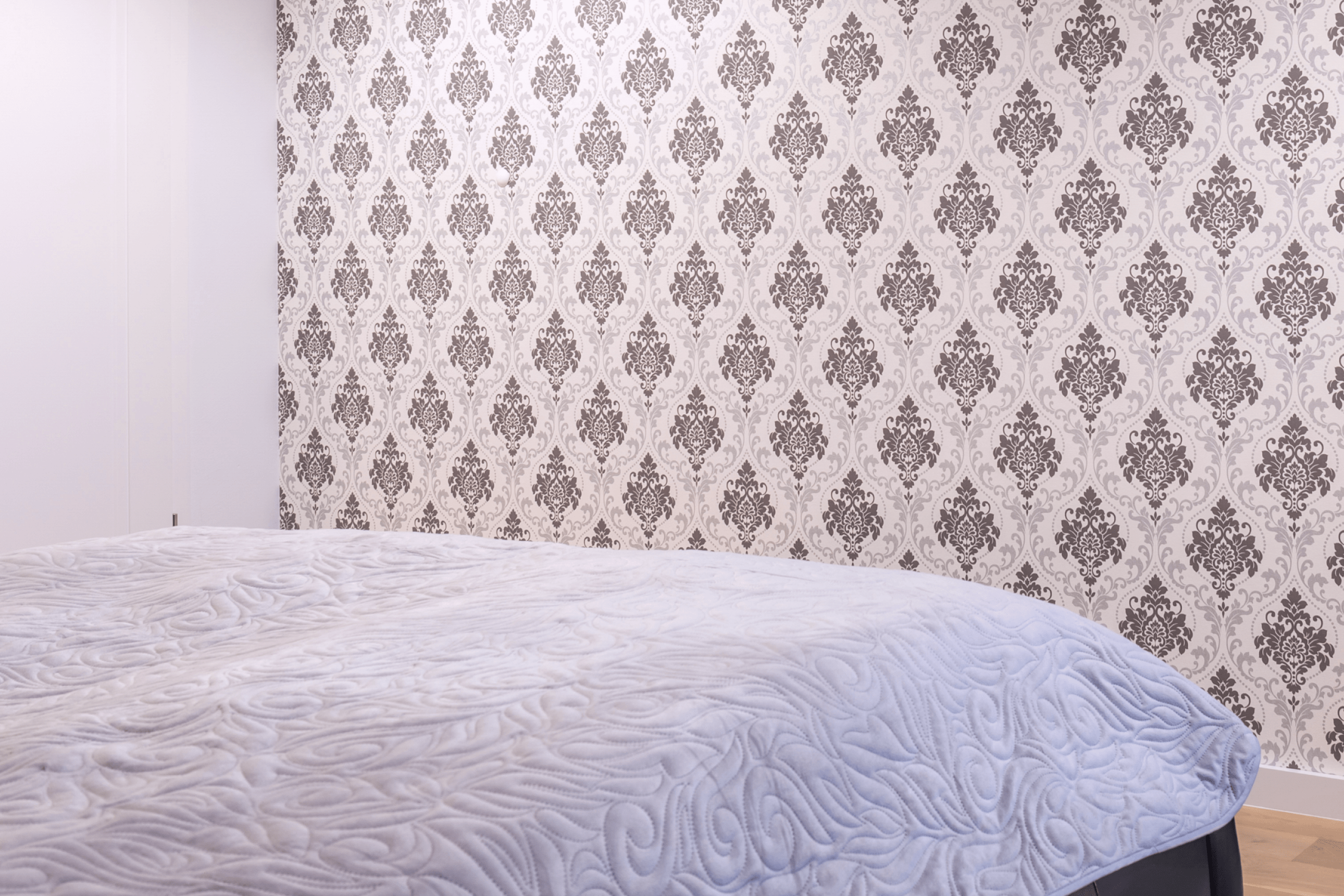 bedroom with pattern wallpaper