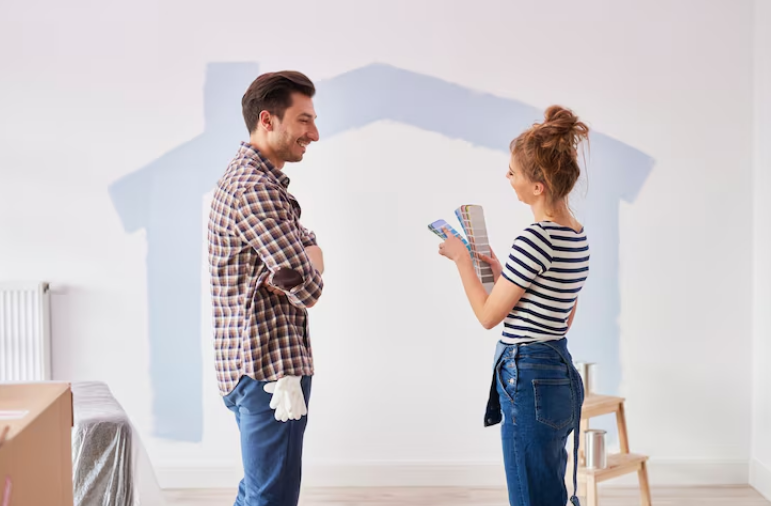 Couple choosing paint colors for a wall