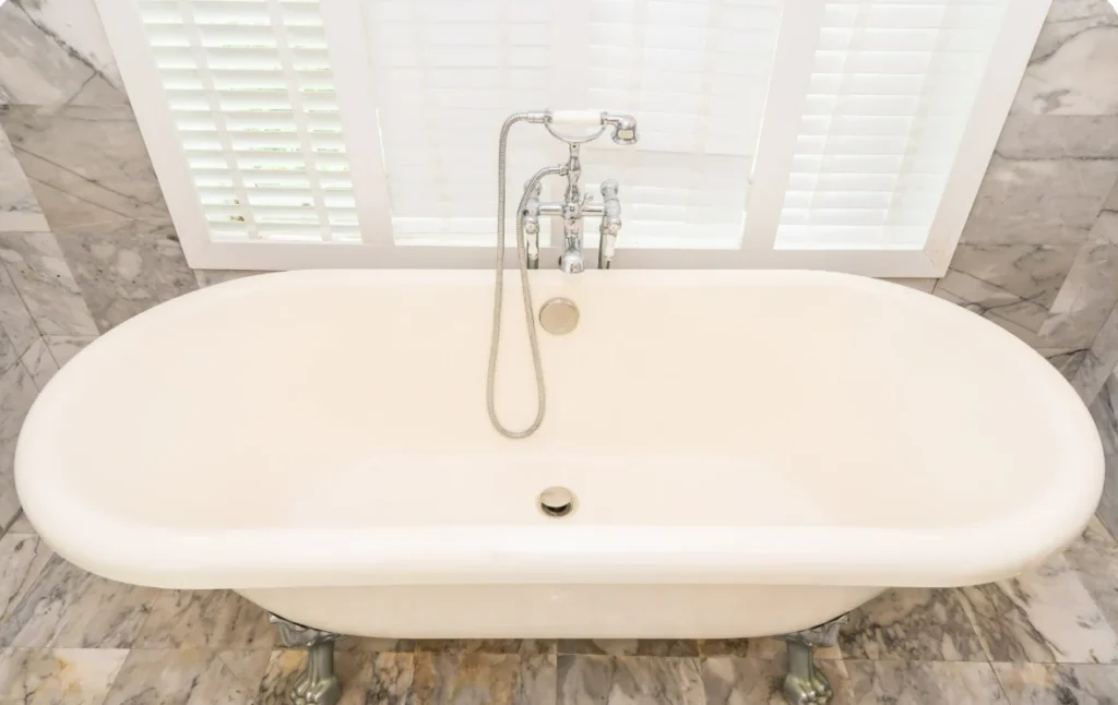 Freestanding bathtub in a luxury remodeled bathroom
